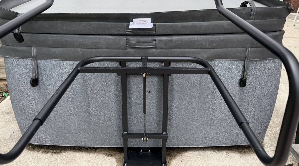 Hot tub hard cover closed and clipped flat on the tub