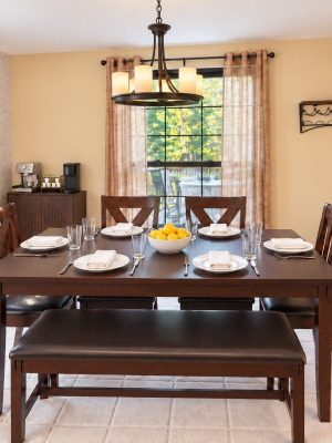 The dining table seats six, and the breakfast bar adds two more.