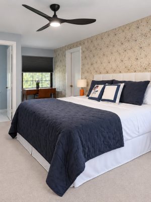 The primary bedroom has space to unpack and its own half bath.