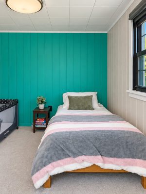 Bedroom 4 has a twin bed and a travel crib for the youngest guests.