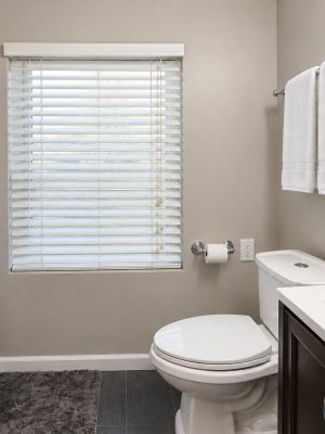 The full bathroom has a tub and shower, with fresh towels for everyone.